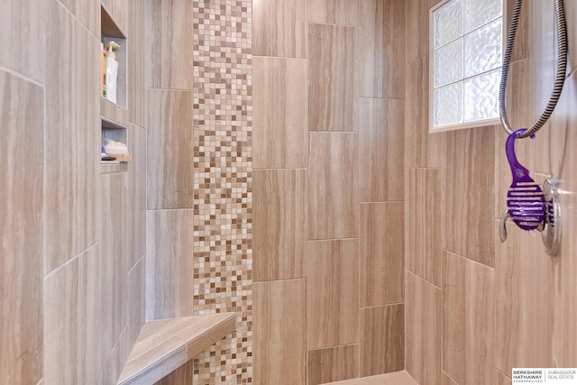 full bathroom featuring tiled shower