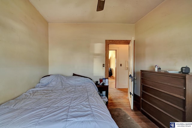 bedroom featuring a ceiling fan and wood finished floors