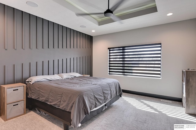 bedroom with ceiling fan, baseboards, carpet floors, recessed lighting, and a raised ceiling