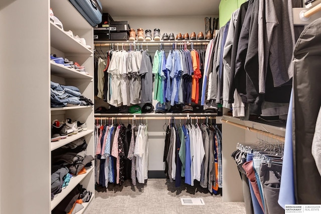 walk in closet with visible vents