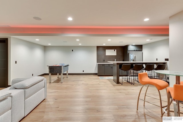 interior space featuring light wood finished floors, recessed lighting, and baseboards