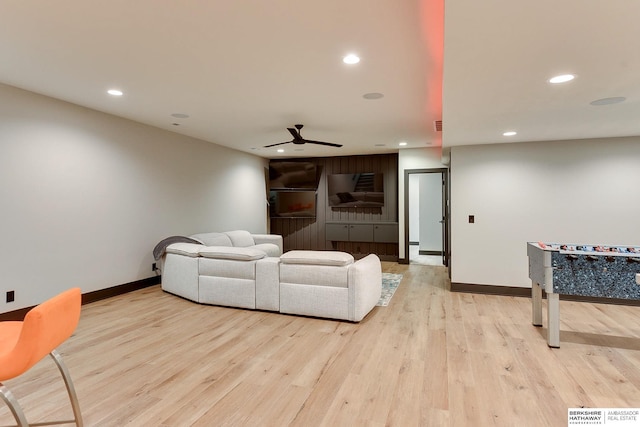 living room with recessed lighting, a ceiling fan, light wood-style floors, and baseboards