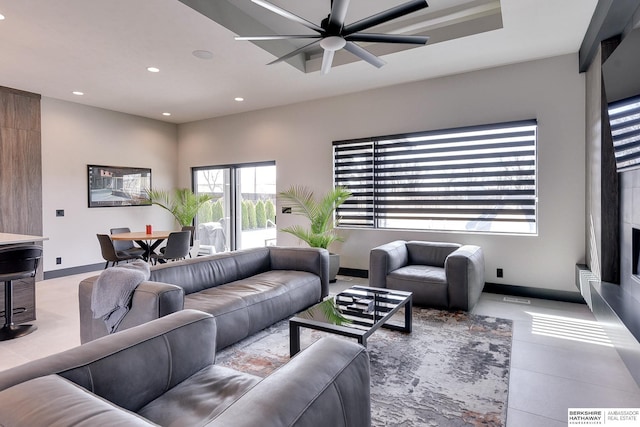 tiled living area with recessed lighting, visible vents, baseboards, and ceiling fan