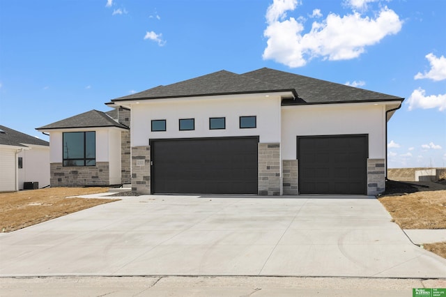 view of front of home with stone siding, stucco siding, and a garage