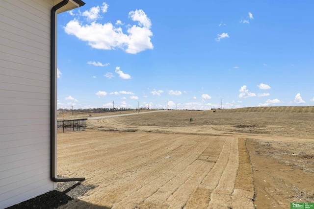 view of yard with a rural view