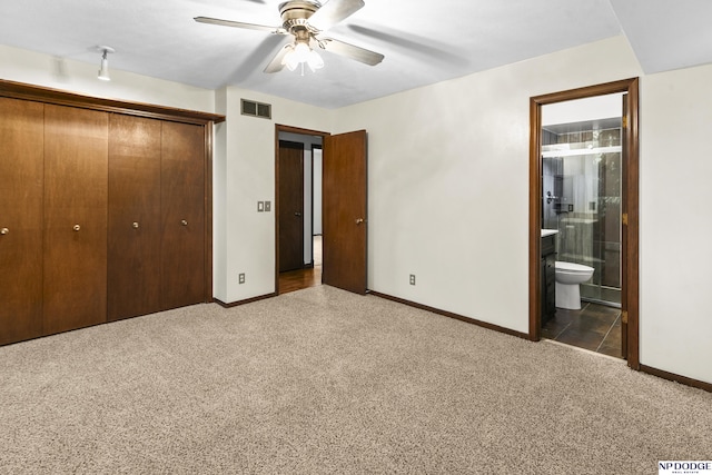 unfurnished bedroom with a closet, visible vents, baseboards, and carpet