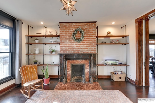 living room with recessed lighting, a fireplace, baseboards, and wood finished floors