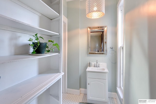 bathroom with vanity and baseboards