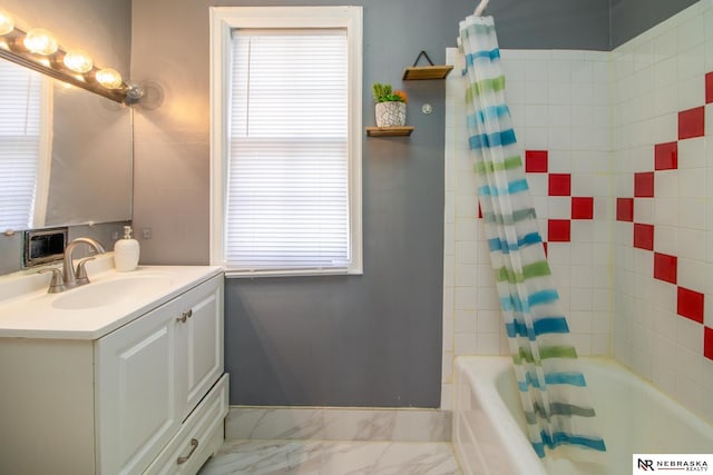 bathroom featuring vanity, shower / bath combo, and marble finish floor