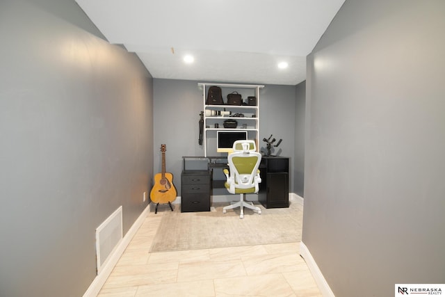 office space featuring recessed lighting, baseboards, and visible vents