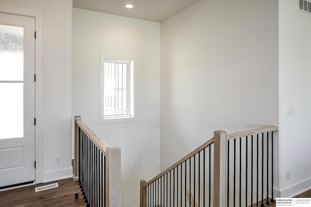 stairs with visible vents, recessed lighting, baseboards, and wood finished floors