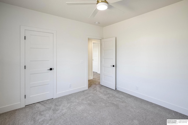 unfurnished bedroom with visible vents, baseboards, carpet, and a ceiling fan