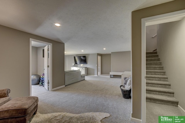 interior space featuring stairway, recessed lighting, baseboards, and a textured ceiling