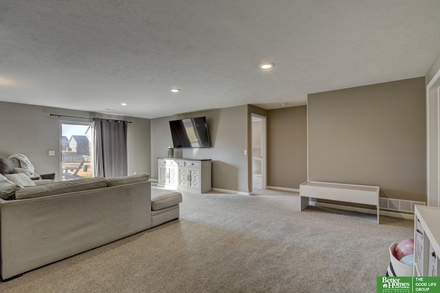 living area with visible vents, light carpet, a textured ceiling, recessed lighting, and baseboards