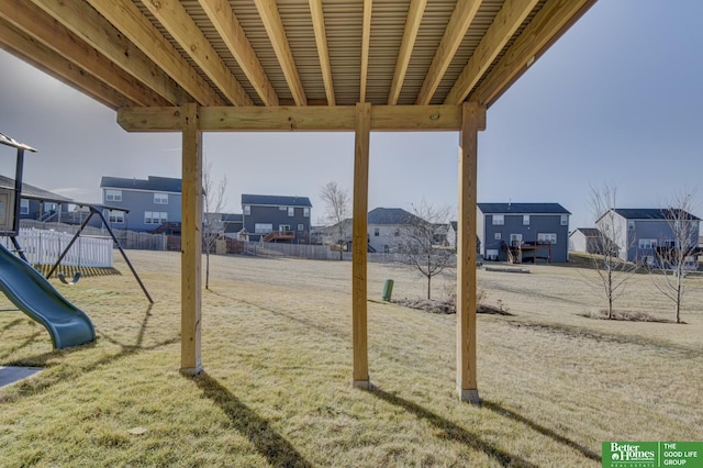 view of yard featuring playground community and a residential view