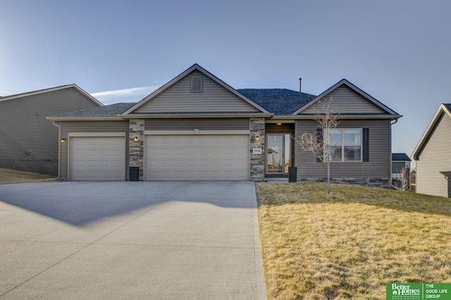 single story home featuring a front lawn, stone siding, roof with shingles, concrete driveway, and a garage