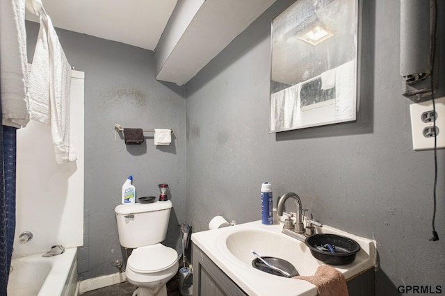 bathroom with baseboards, toilet, and vanity