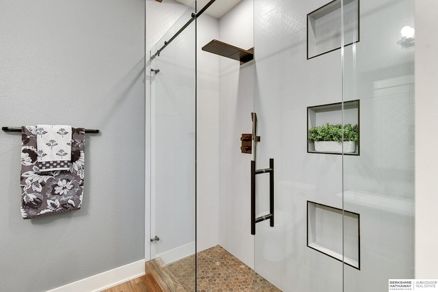 full bathroom featuring a shower with shower door