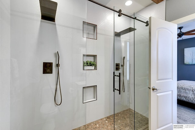 ensuite bathroom with ceiling fan, an enclosed shower, and connected bathroom