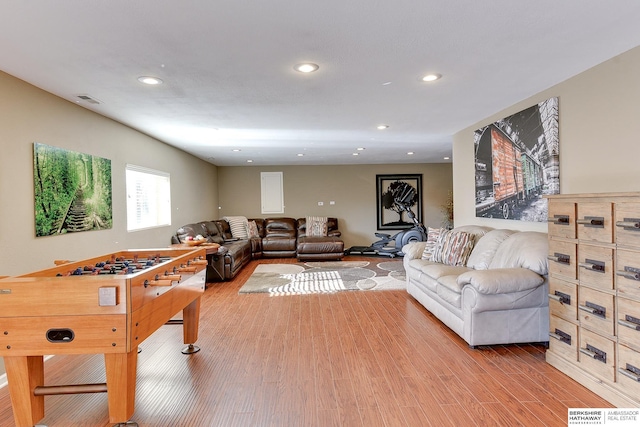 rec room featuring recessed lighting, visible vents, and light wood-style flooring