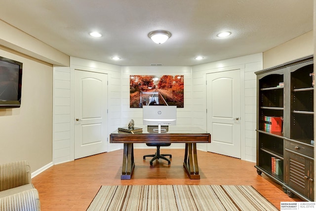 office area with visible vents, recessed lighting, a textured ceiling, and light wood-type flooring