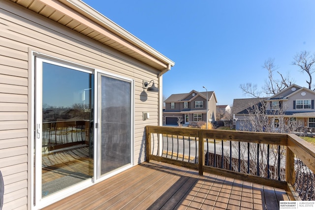 wooden deck with a residential view