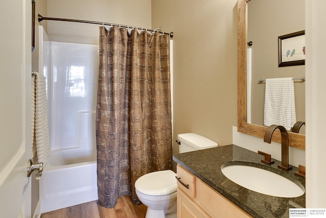 full bath with shower / bath combo with shower curtain, toilet, vanity, and wood finished floors