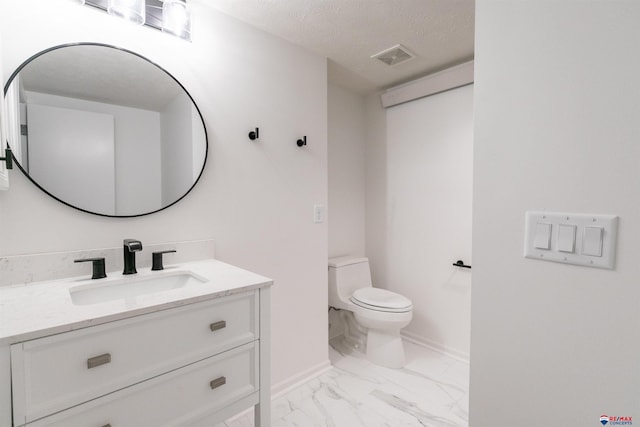 bathroom featuring visible vents, toilet, marble finish floor, a textured ceiling, and vanity