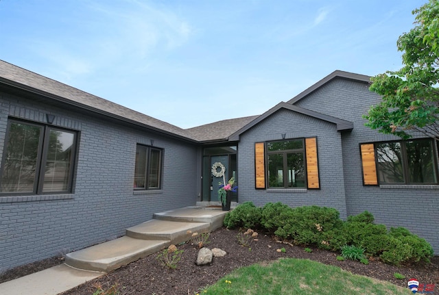 view of front of home with brick siding