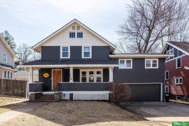 view of front of house featuring fence, aphalt driveway, a porch, roof with shingles, and an attached garage