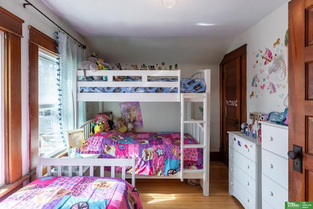 bedroom with light wood finished floors