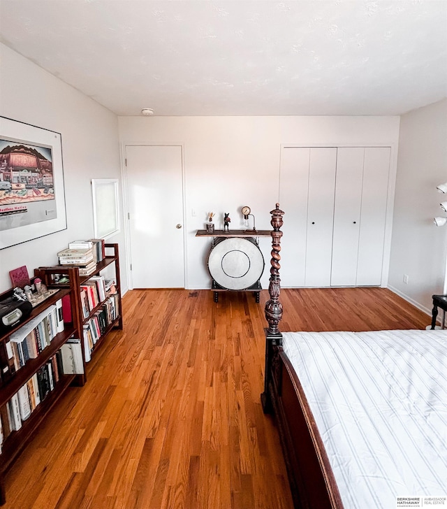 bedroom featuring a closet and wood finished floors