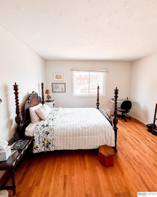 bedroom featuring wood finished floors