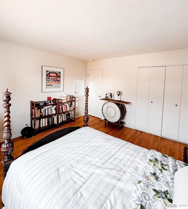 bedroom with a closet and wood finished floors