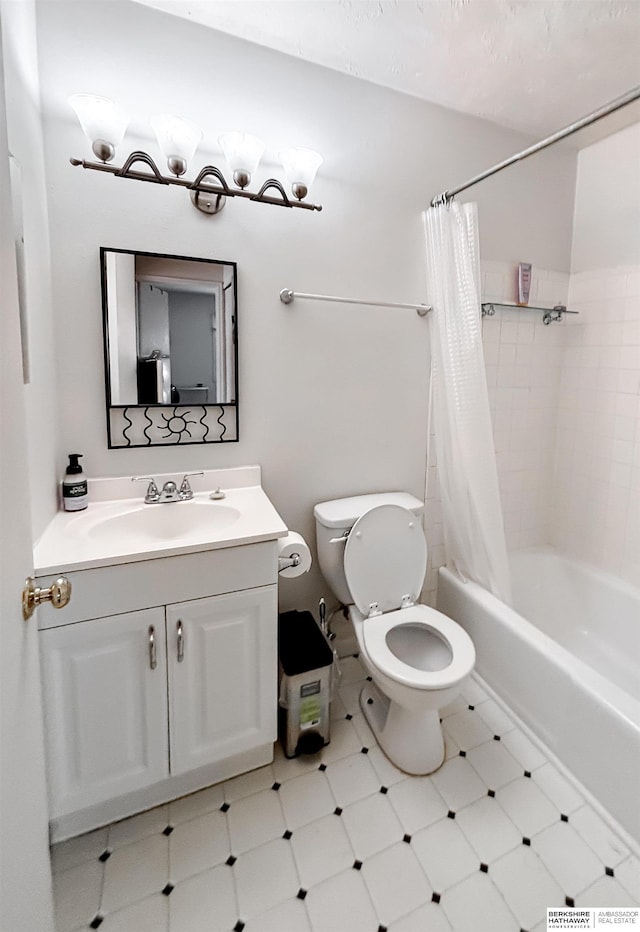 full bathroom with vanity, toilet, and shower / tub combo with curtain