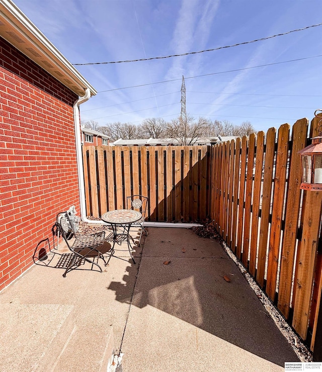 view of patio / terrace featuring fence