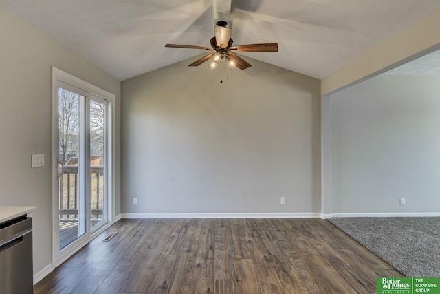 unfurnished room featuring lofted ceiling, baseboards, dark wood-type flooring, and a ceiling fan