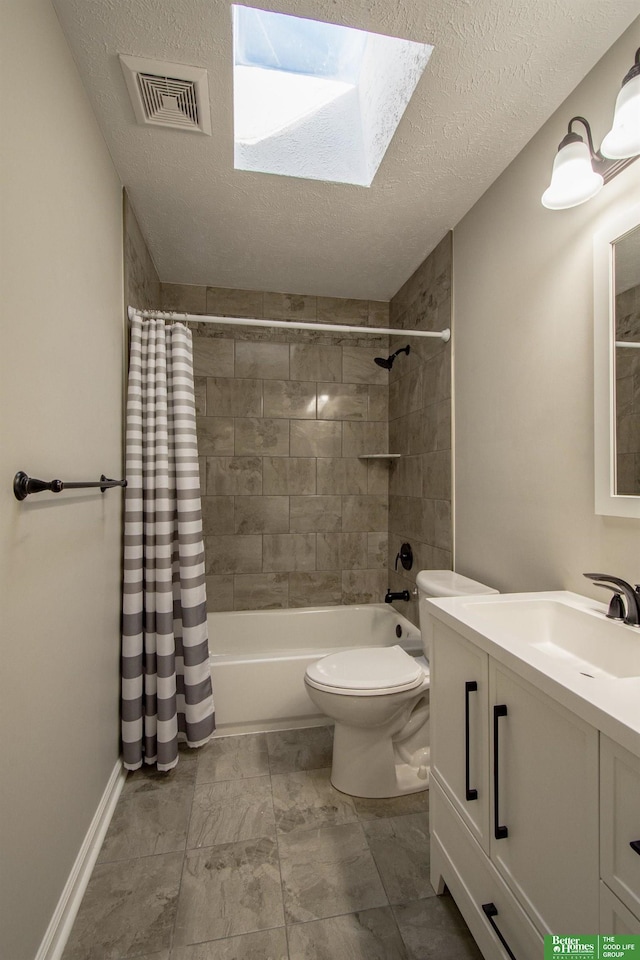 bathroom featuring visible vents, toilet, vanity, shower / bath combo, and a textured ceiling