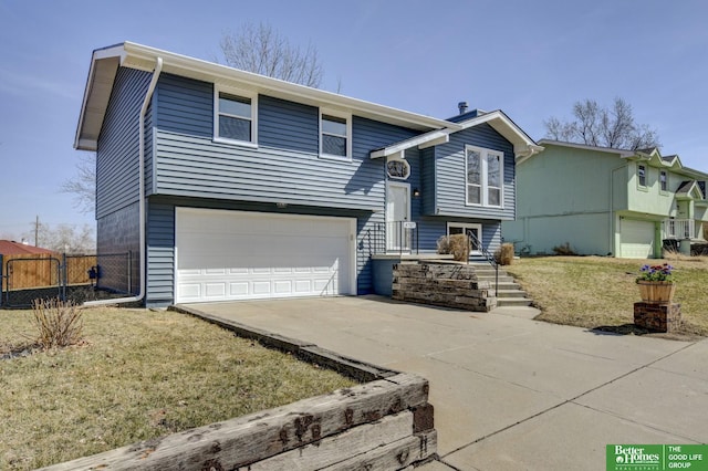 view of front of house featuring driveway, an attached garage, and fence