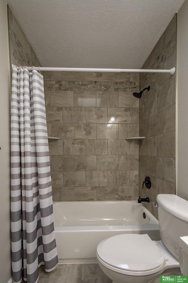 full bathroom with toilet, shower / tub combo with curtain, and a textured ceiling