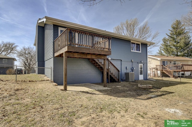 back of house with stairway, central AC, a wooden deck, and fence