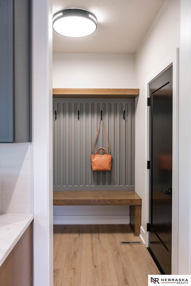 mudroom with light wood-style floors