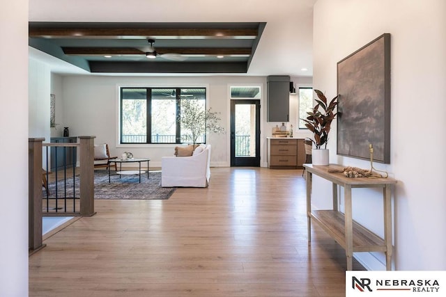 foyer entrance featuring baseboards, light wood finished floors, recessed lighting, ceiling fan, and beamed ceiling