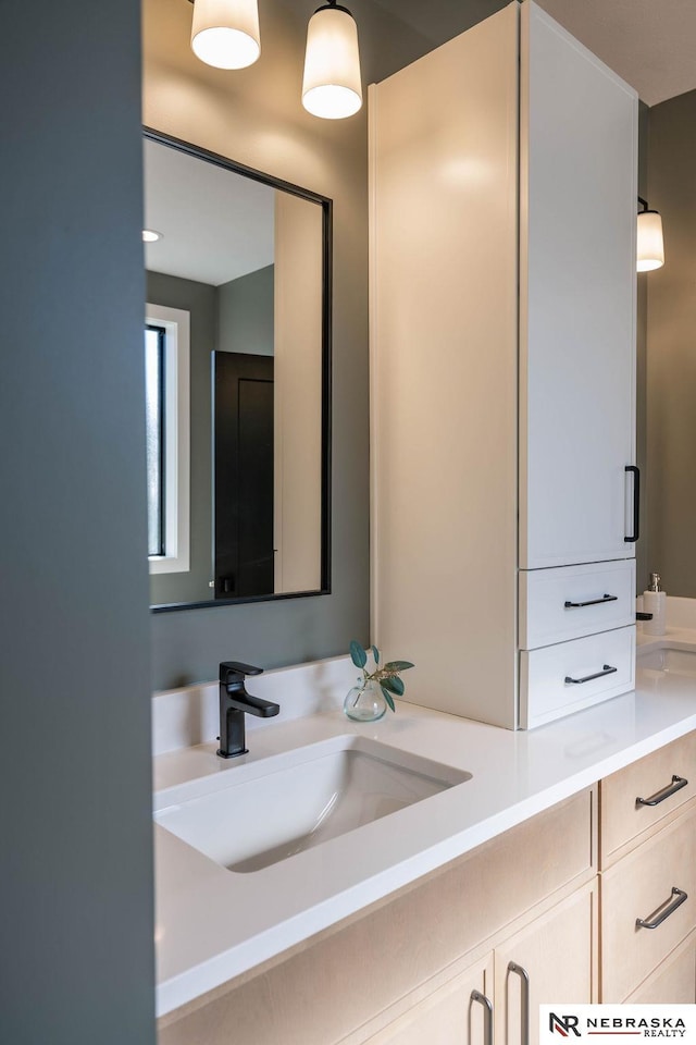 bathroom with double vanity and a sink