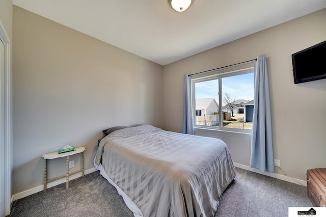 carpeted bedroom with baseboards