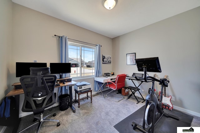 office with baseboards and carpet floors