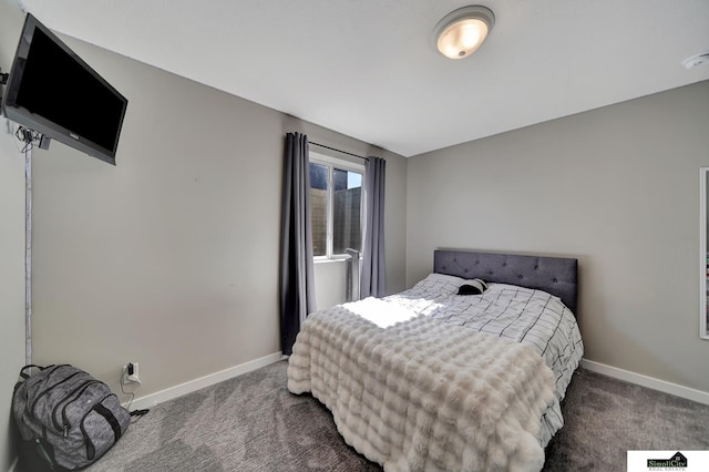 carpeted bedroom with baseboards