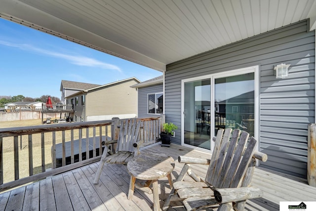 wooden terrace with a residential view