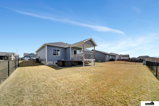 back of house featuring a deck, cooling unit, a fenced backyard, and a yard