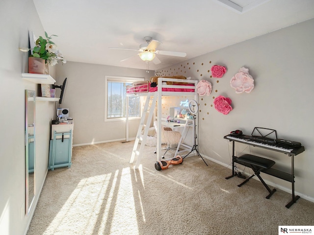 carpeted bedroom featuring baseboards and a ceiling fan